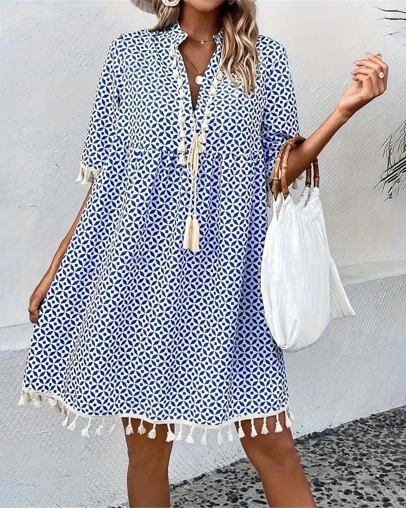 Stylish women's geometric print boho mini tunic dress with tassel trim, a versatile casual summer outfit.