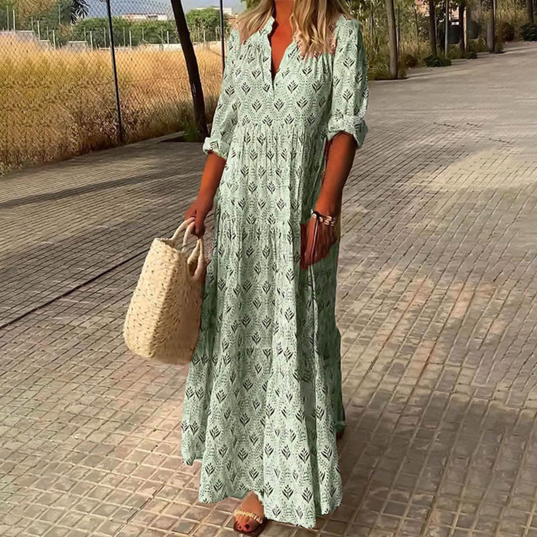 Casual women's long sleeve maxi dress with a bohemian print, V-neck, and adjustable roll-up sleeves. Flowy and comfortable.