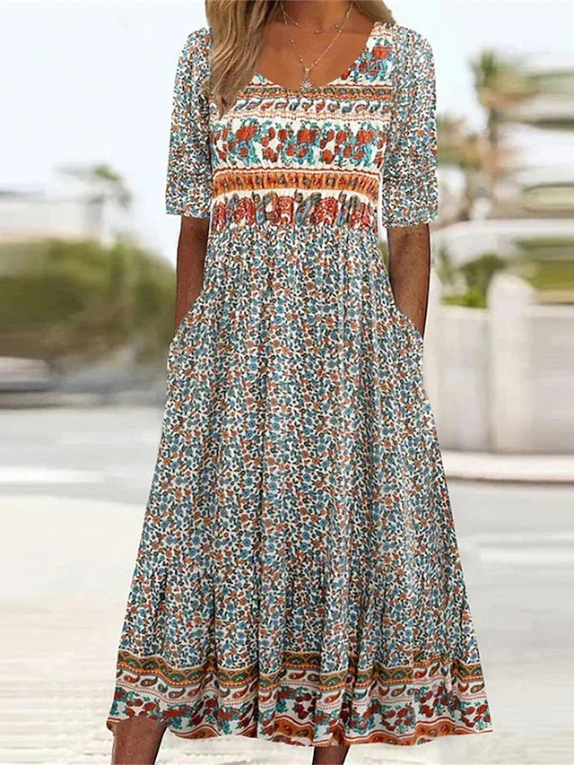 Women's boho print midi dress with short sleeves & practical pockets, perfect for casual summer wear.
