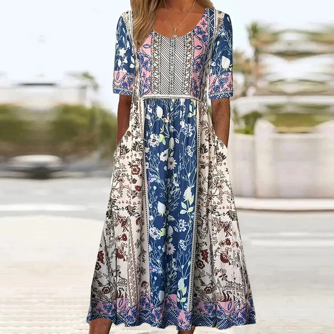 Casual women's midi dress with a vibrant boho print, relaxed fit, short sleeves, and convenient pockets.