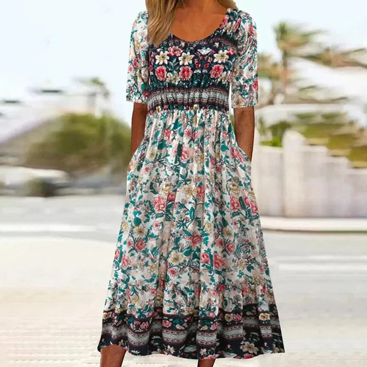 Versatile women's boho print midi dress with pockets, ideal for everyday wear or a chic vacation look.