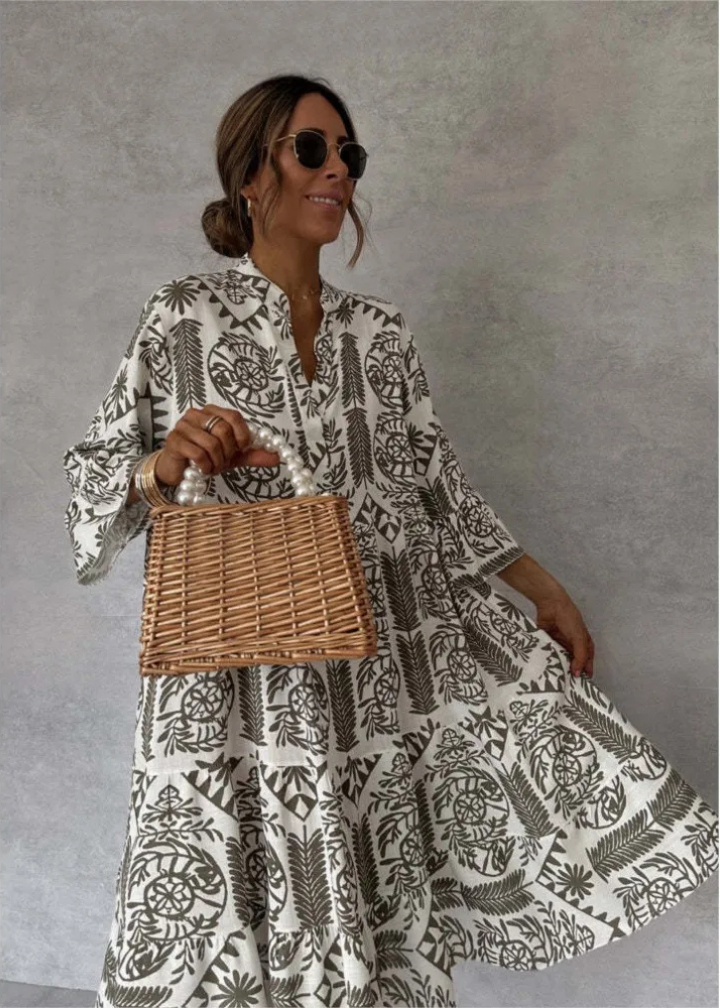 Statement women's boho midi dress with a unique print, oversized flowy design, and long sleeves.