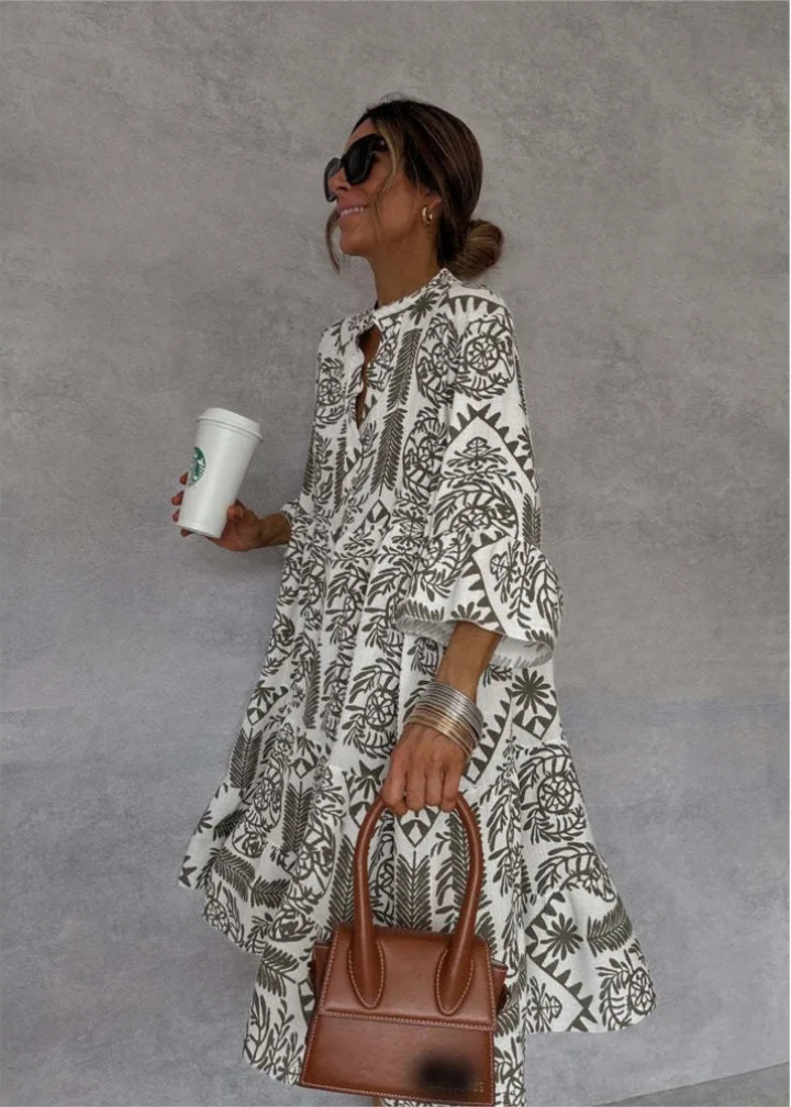 Casual women's summer midi dress, showcasing a beautiful boho print and an airy, oversized fit.