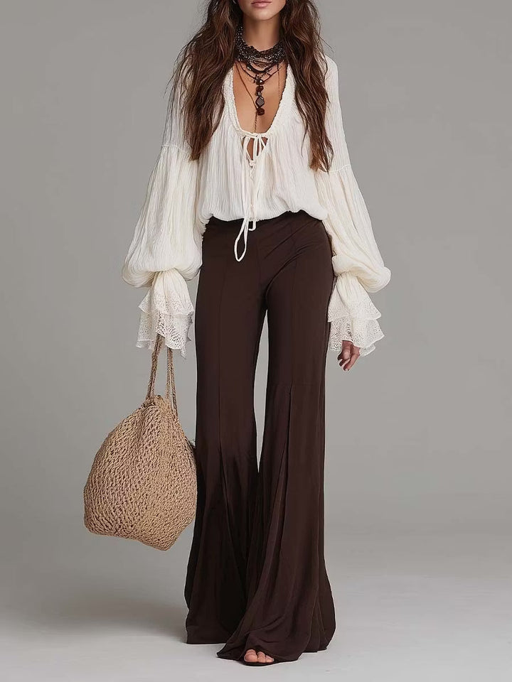 Women's boho two-piece set: lace-up crop top & wide-leg flare pants for a chic summer festival outfit.