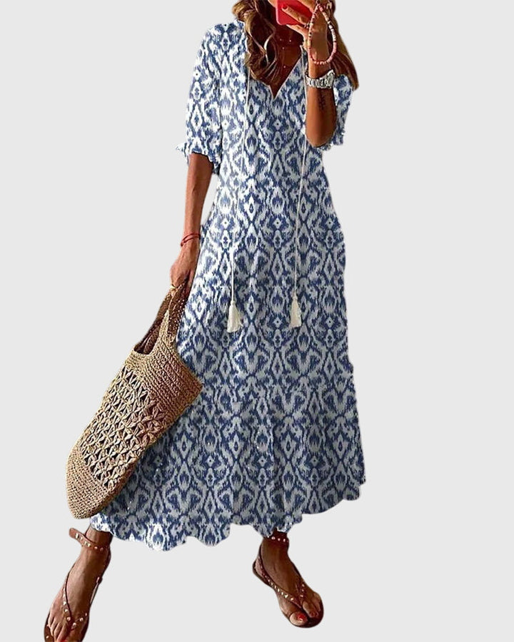 Women's Boho Vintage Summer Maxi Dress, flowy v-neck, perfect for beach vacations.