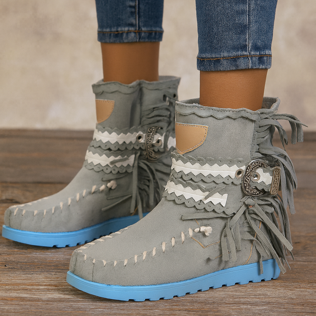 Stylish women's ankle boots featuring Western-inspired design and chic fringe detailing