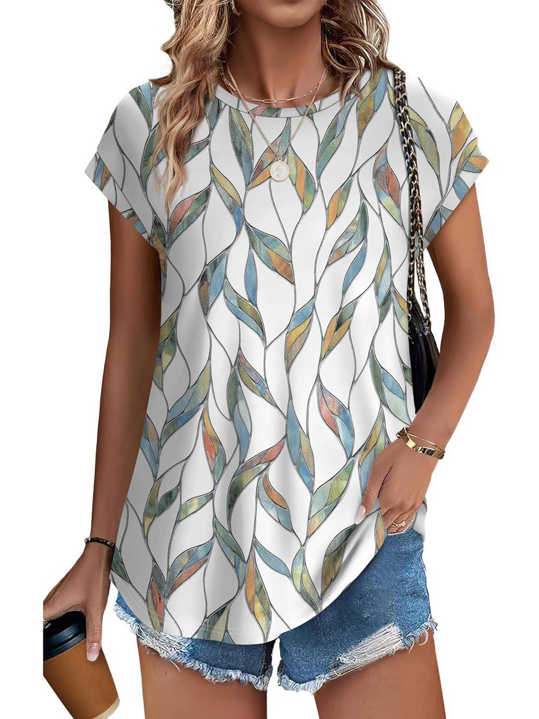 Women's botanical leaf print cap sleeve top. A comfortable summer blouse with a vibrant leaf pattern.