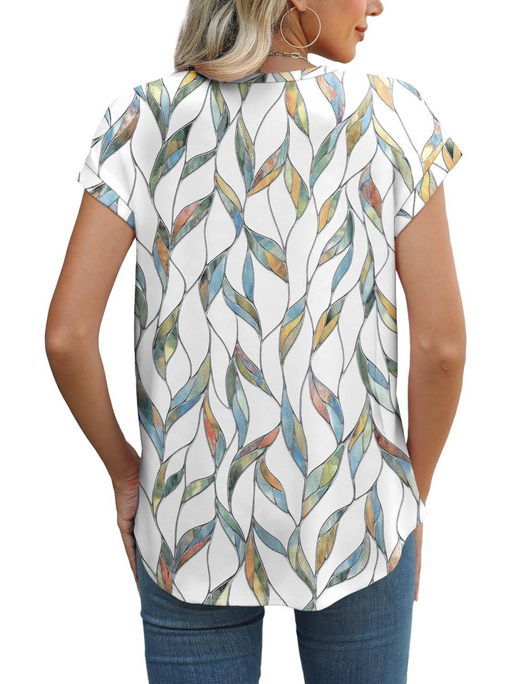 Stylish women's cap sleeve blouse, featuring a chic botanical leaf print, ideal for everyday fashion.
