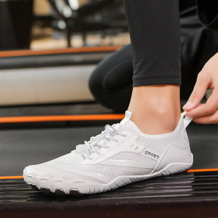 Minimalist women's athletic shoes with zero drop & flexible sole for walking & comfort.