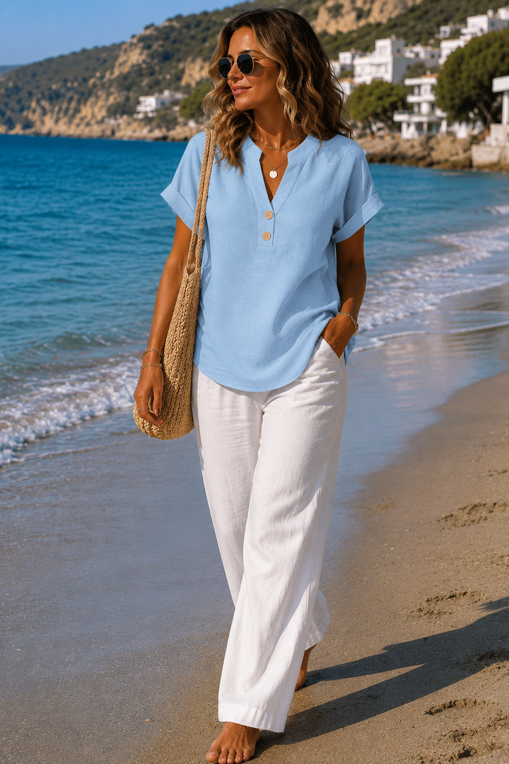 Chic long-sleeve button-up blouse for versatile spring and summer fashion.