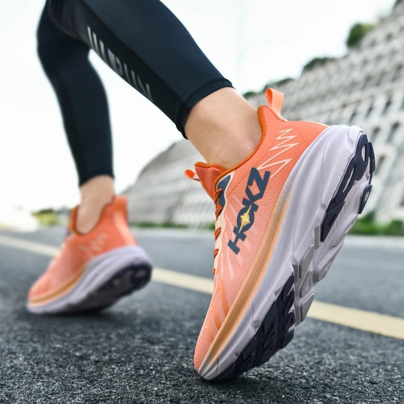 Stylish women's athletic shoes with a chunky sole & breathable design, ideal for running & workouts.
