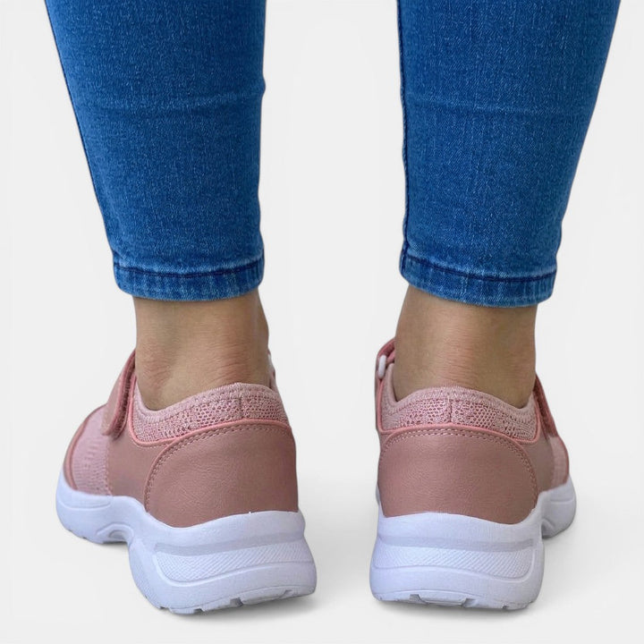 Light pink women's breathable orthopedic slip-on sneakers, offering ultimate foot support for casual wear.