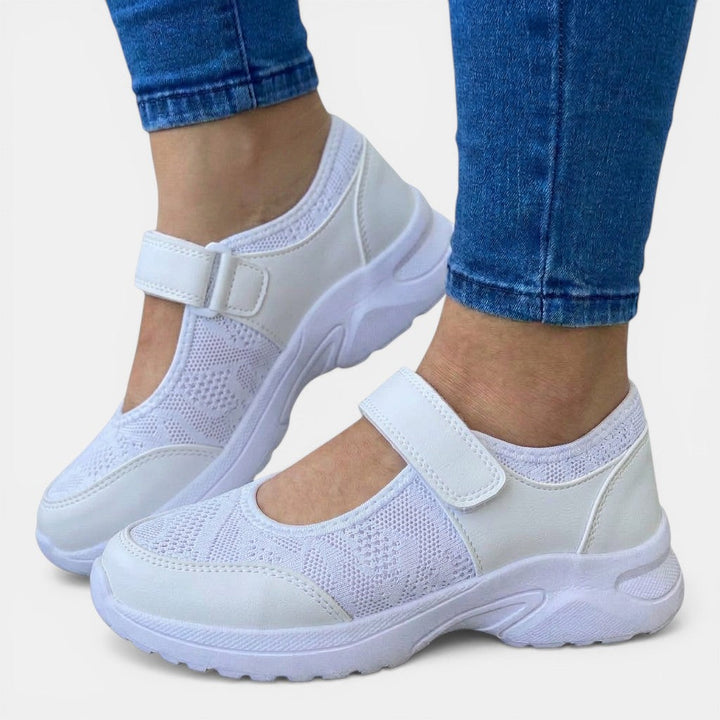 White women's athletic casual slip-on sneakers with breathable upper & orthopedic arch support for walking.
