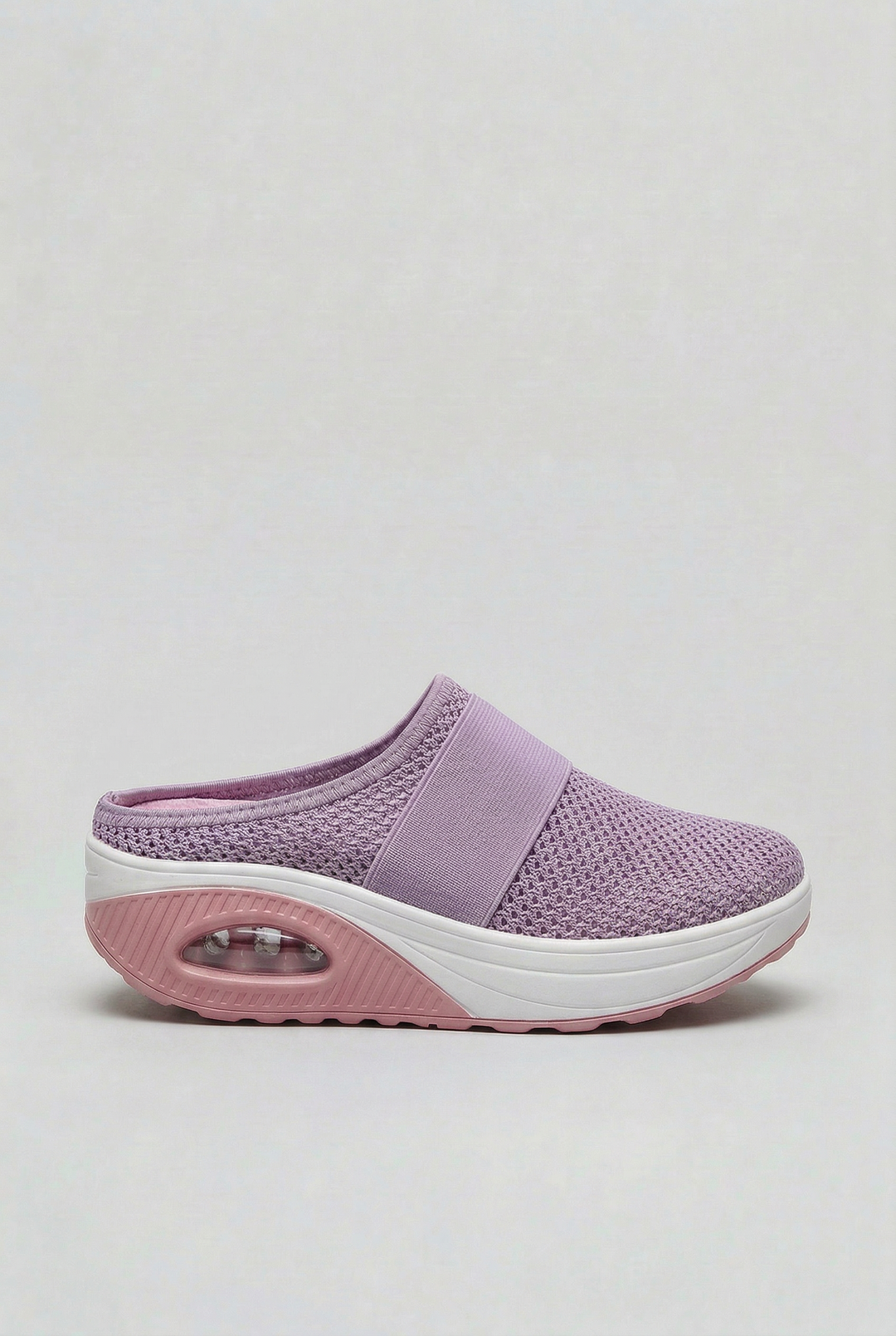Casual women's mules with breathable fabric & supportive air cushion for daily comfort.