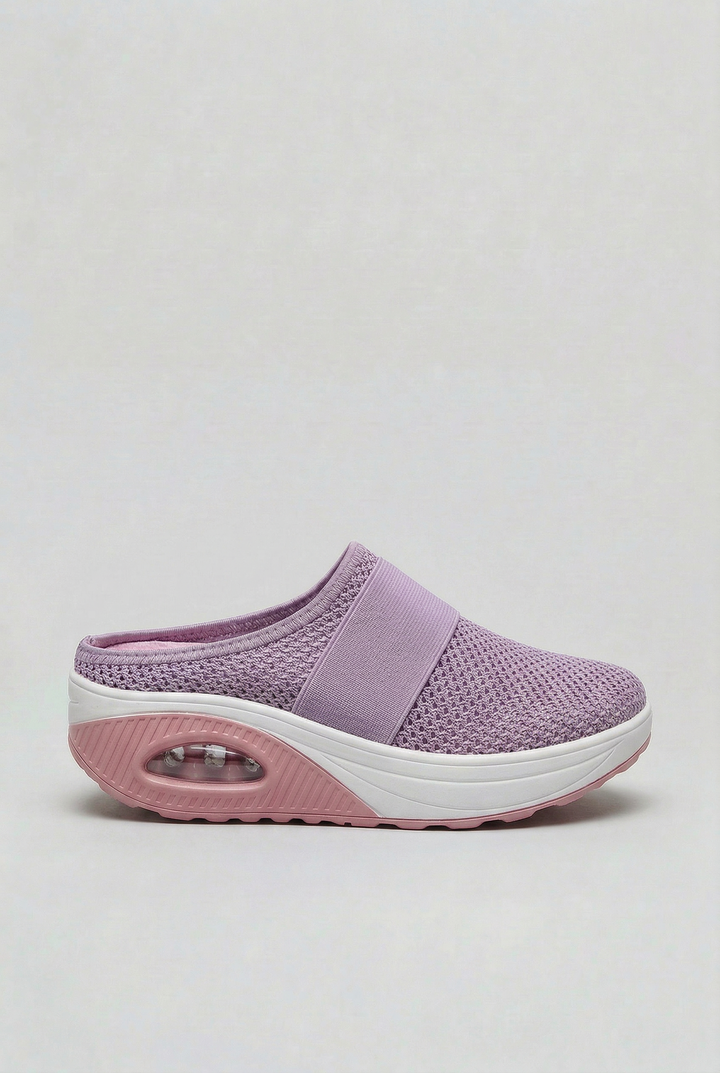 Casual women's mules with breathable fabric & supportive air cushion for daily comfort.