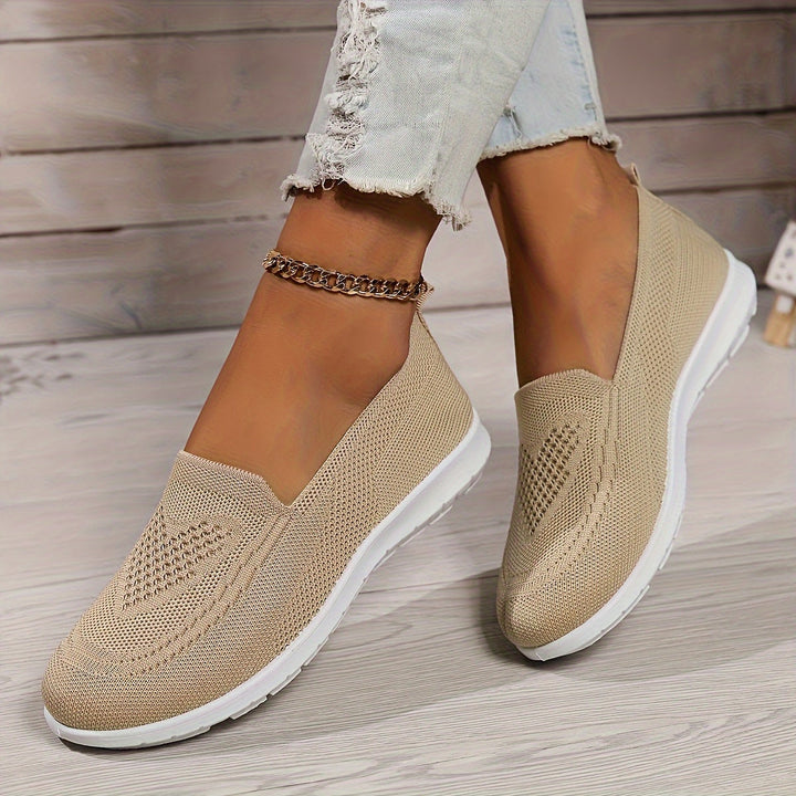 Comfortable women's slip-on walking shoes, perfect for easy wear & daily activities. Breathable & versatile design.