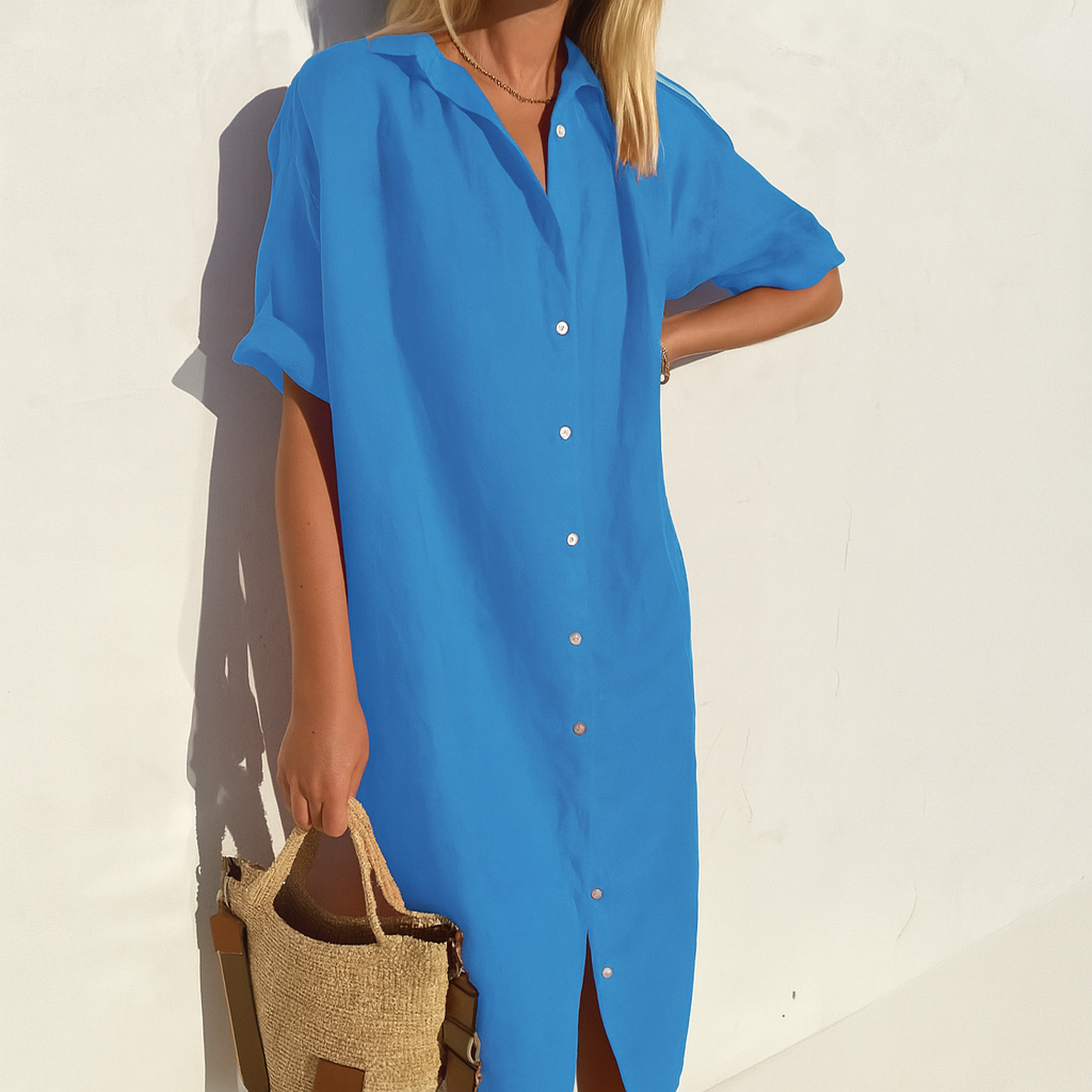 Model in a versatile women's breezy button-down midi shirt dress, perfect for effortless day and summer style.