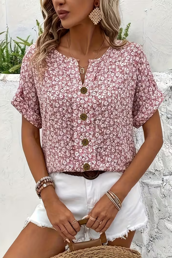 Comfortable women's short sleeve floral blouse with a relaxed fit, great for everyday summer fashion.