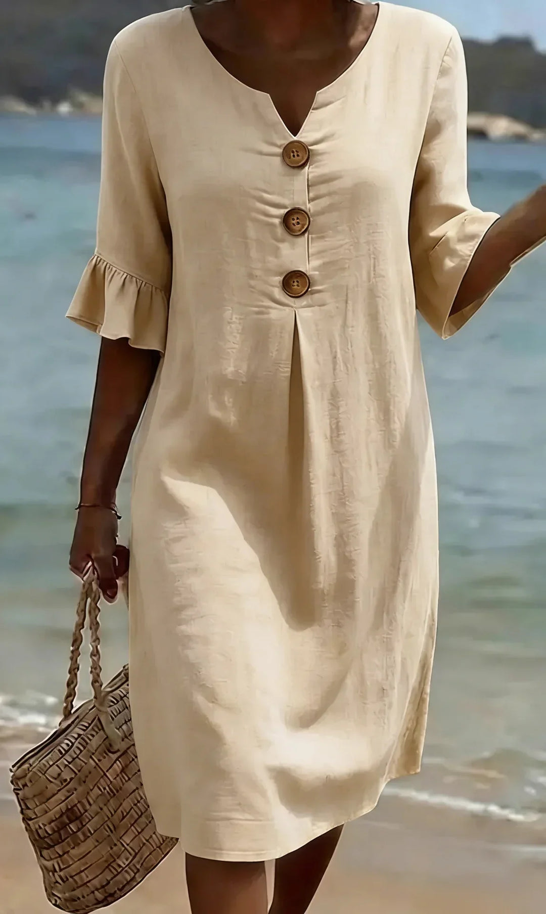 Elegant casual women's midi dress with a full button front and delicate ruffle sleeves, great for outings.