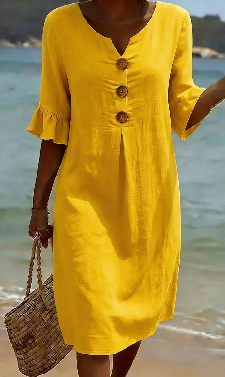 Versatile women's midi dress with button closure, flowy skirt, and stylish ruffle sleeves for comfort.
