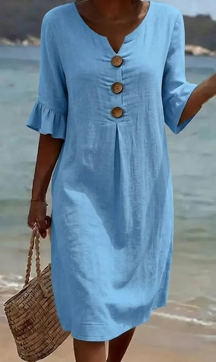 Lightweight summer midi dress for women, featuring a button front and cute ruffle sleeves.