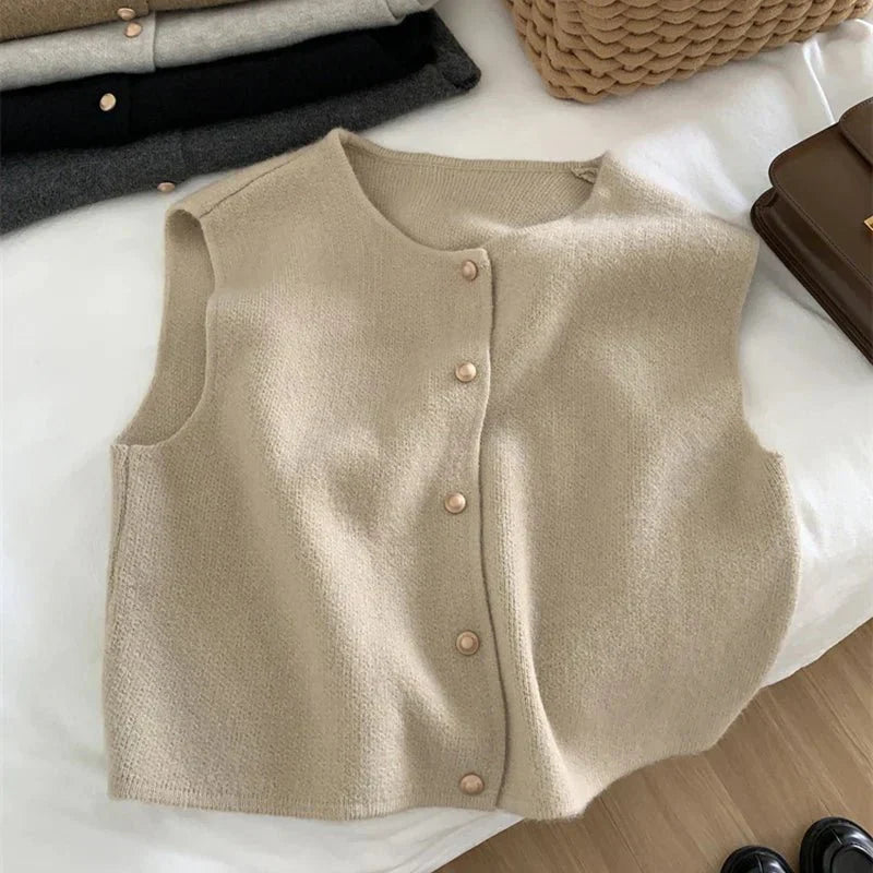 Comfortable women's apparel: a sleeveless button-up vest in a neutral tone, suitable for various outfits.
