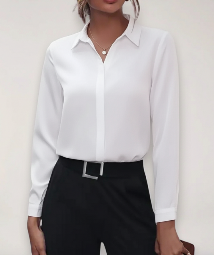 Women's buttoned office blouse in white, tailored fit, ideal for professional attire and business casual.