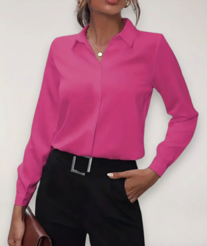 Stylish women's buttoned blouse in a pastel color, offering a sophisticated look for office and casual.