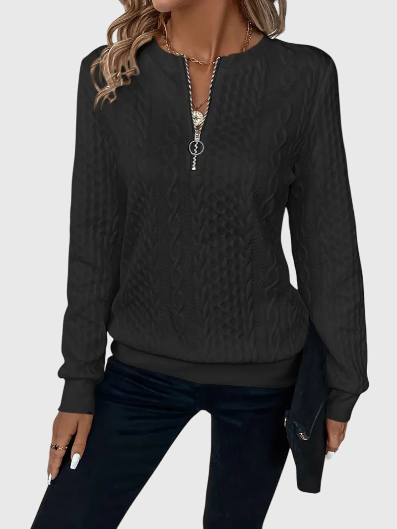 Cozy women's cable knit quarter-zip pullover, a textured sweater for winter warmth and style.