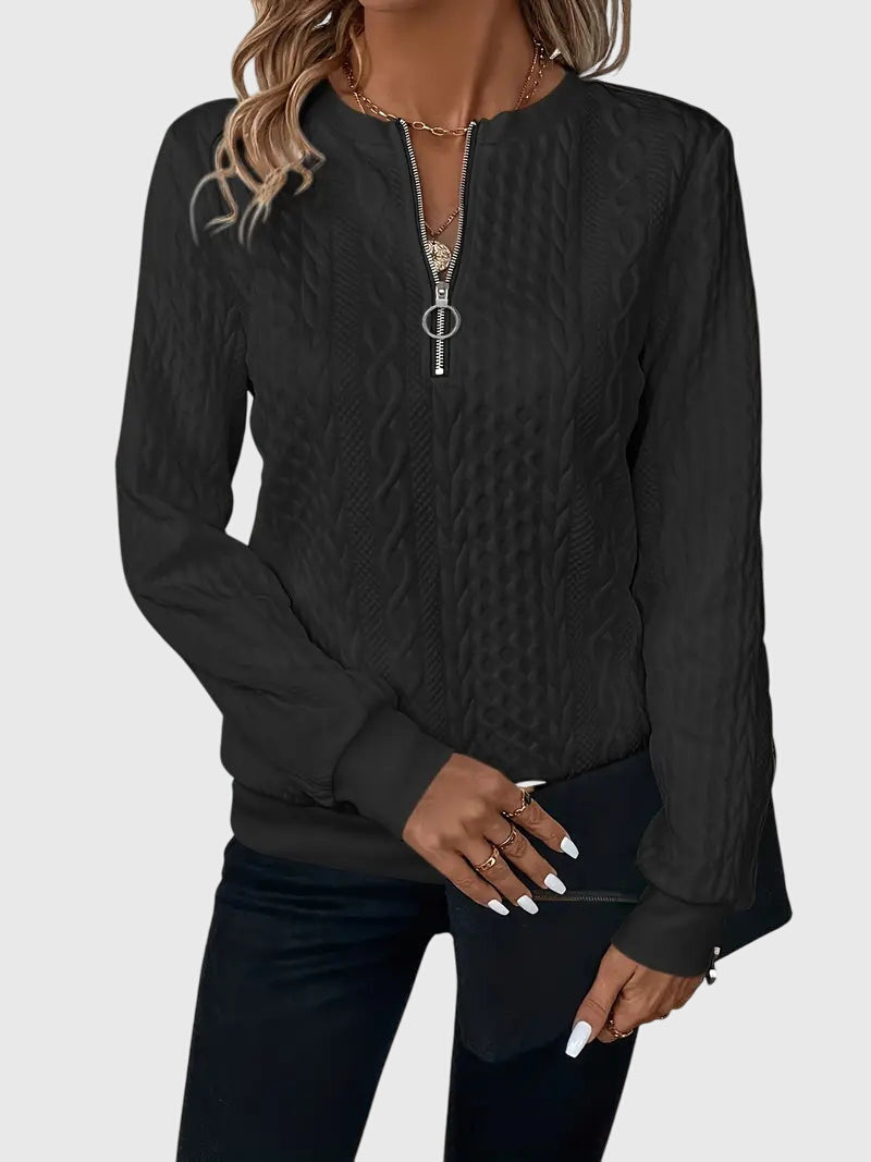 Elegant women's cable knit quarter-zip sweater, ideal for casual wear and everyday style.