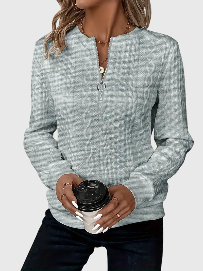 Women's cable knit quarter-zip pullover, a must-have for fall fashion and winter warmth.