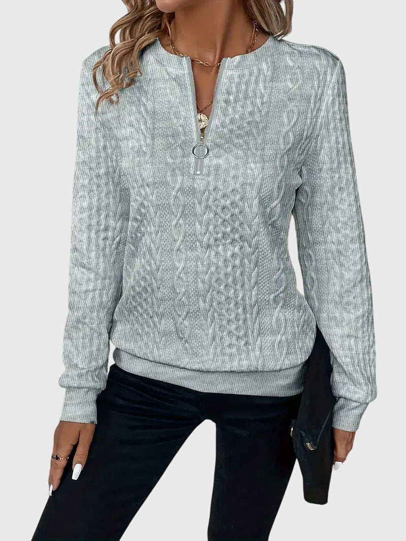 Versatile women's cable knit quarter-zip top, an easy layering piece for any season.