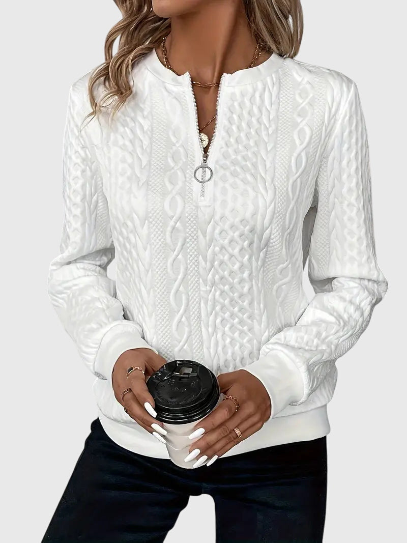 Effortless women's cable knit quarter-zip sweater, a cozy layering piece for casual outfits.