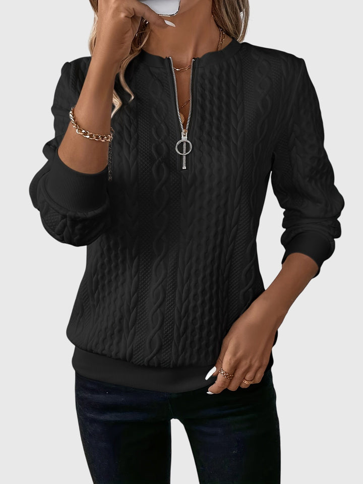 Fall fashion women's cable knit quarter-zip sweater, perfect for versatile everyday wear.