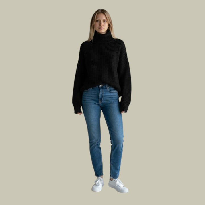 Front view of a women's long sleeve winter turtleneck sweater, featuring a modern relaxed fit