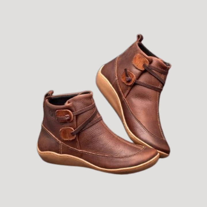 Women's casual ankle strap boots in brown leather, perfect for spring fashion and versatile outfits.