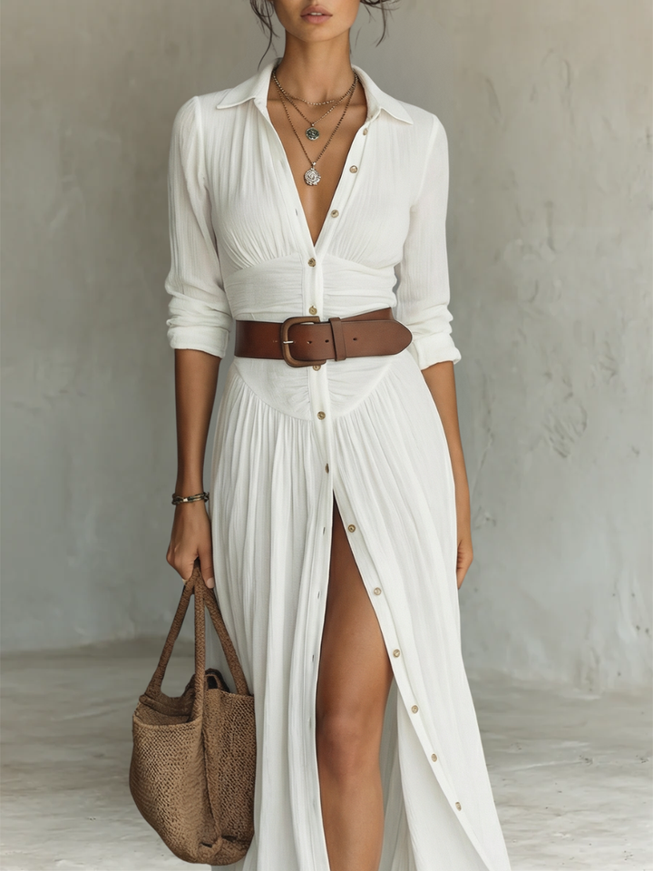 Collared women's shirt dress, maxi length, boho style, with an adjustable belted waist. Casual summer wear.