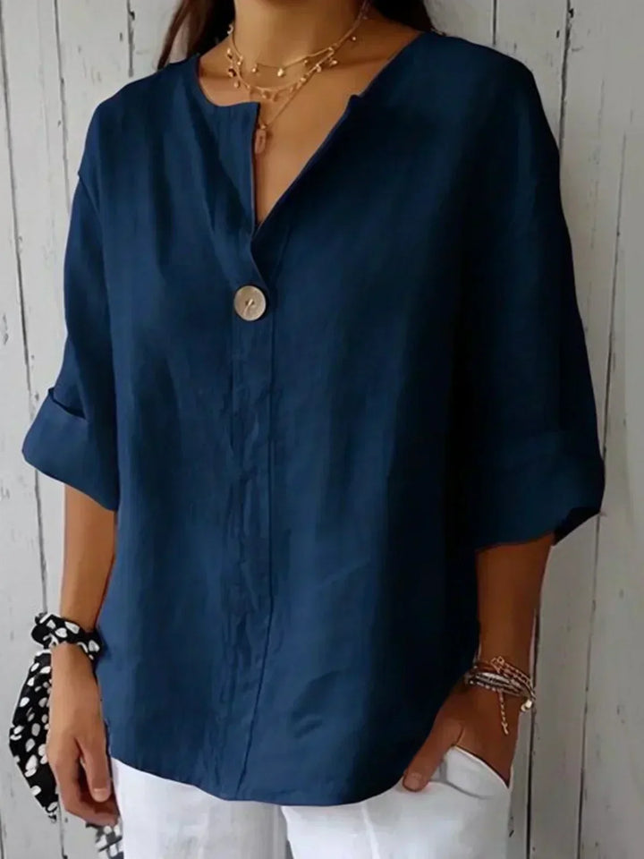 Relaxed fit women's tunic blouse with button front, 3/4 sleeves, ideal casual summer top for vacation & comfort.