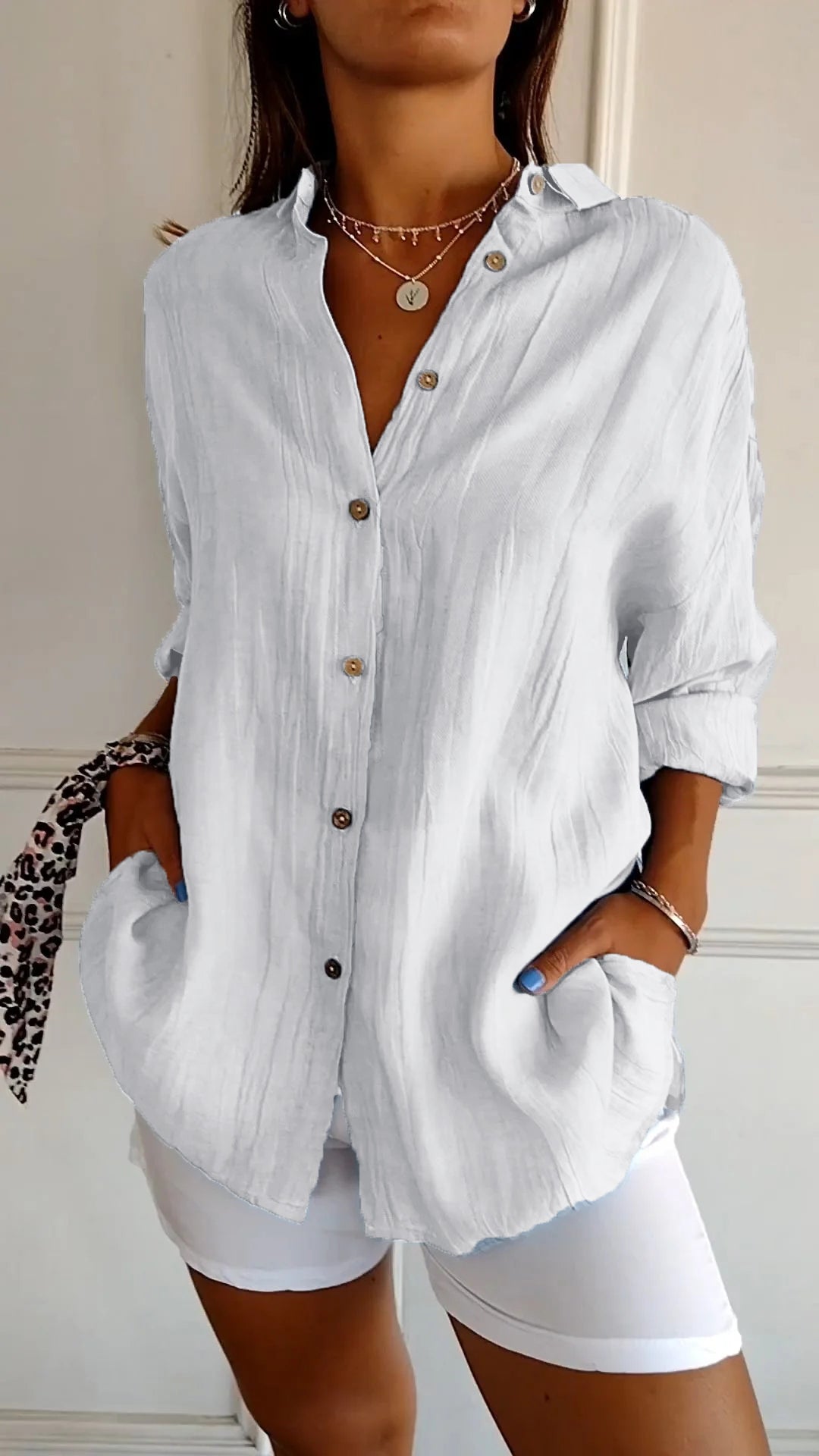 Versatile women's long sleeve button-down shirt, great for casual wear or as a stylish spring blouse.