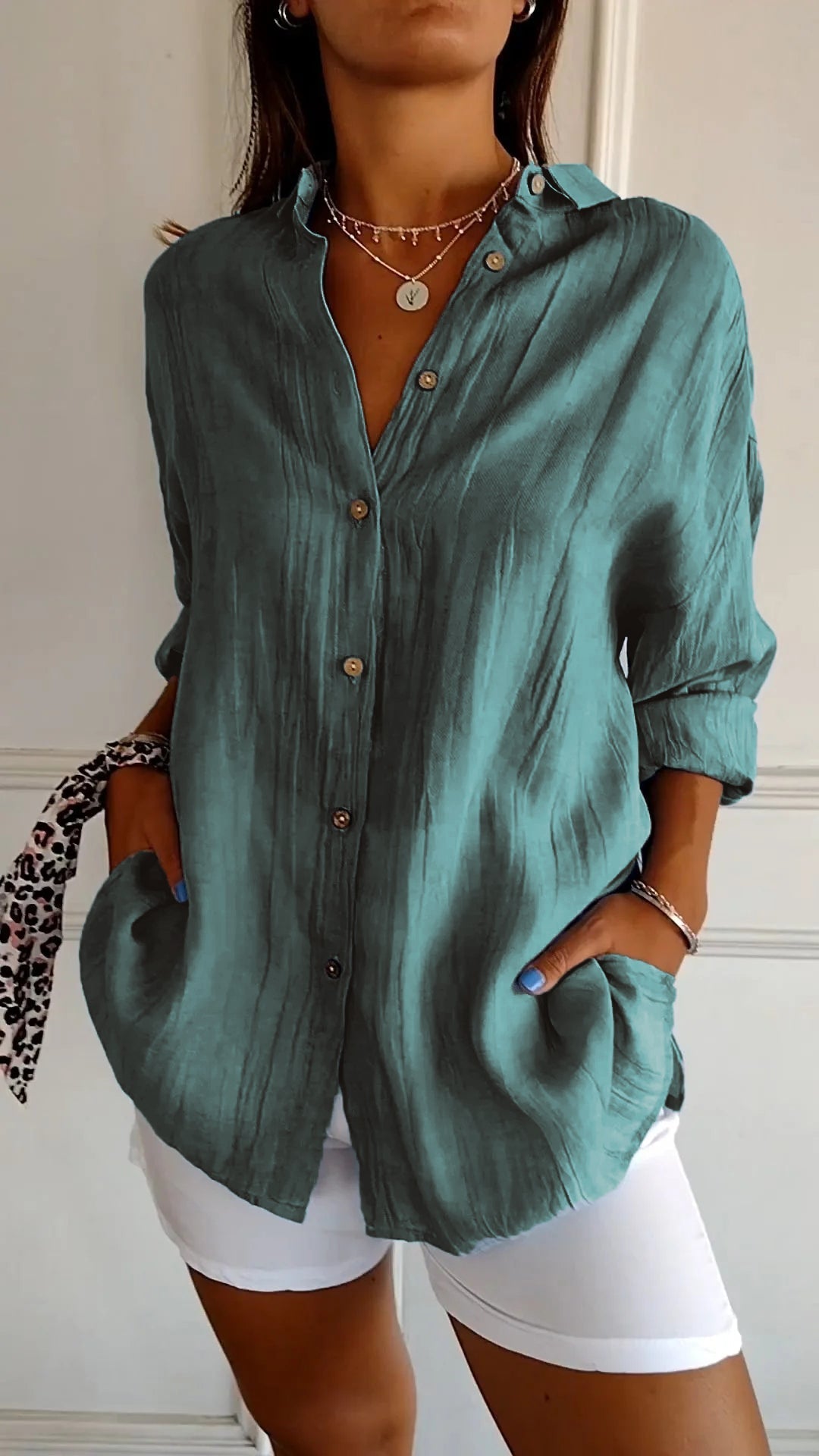 Stylish women's oversized button-down shirt, a perfect long sleeve top for spring and summer.