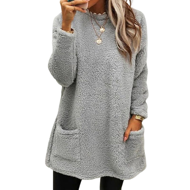 Back view of a black women's t-shirt dress, highlighting the relaxed fit and long sleeve design