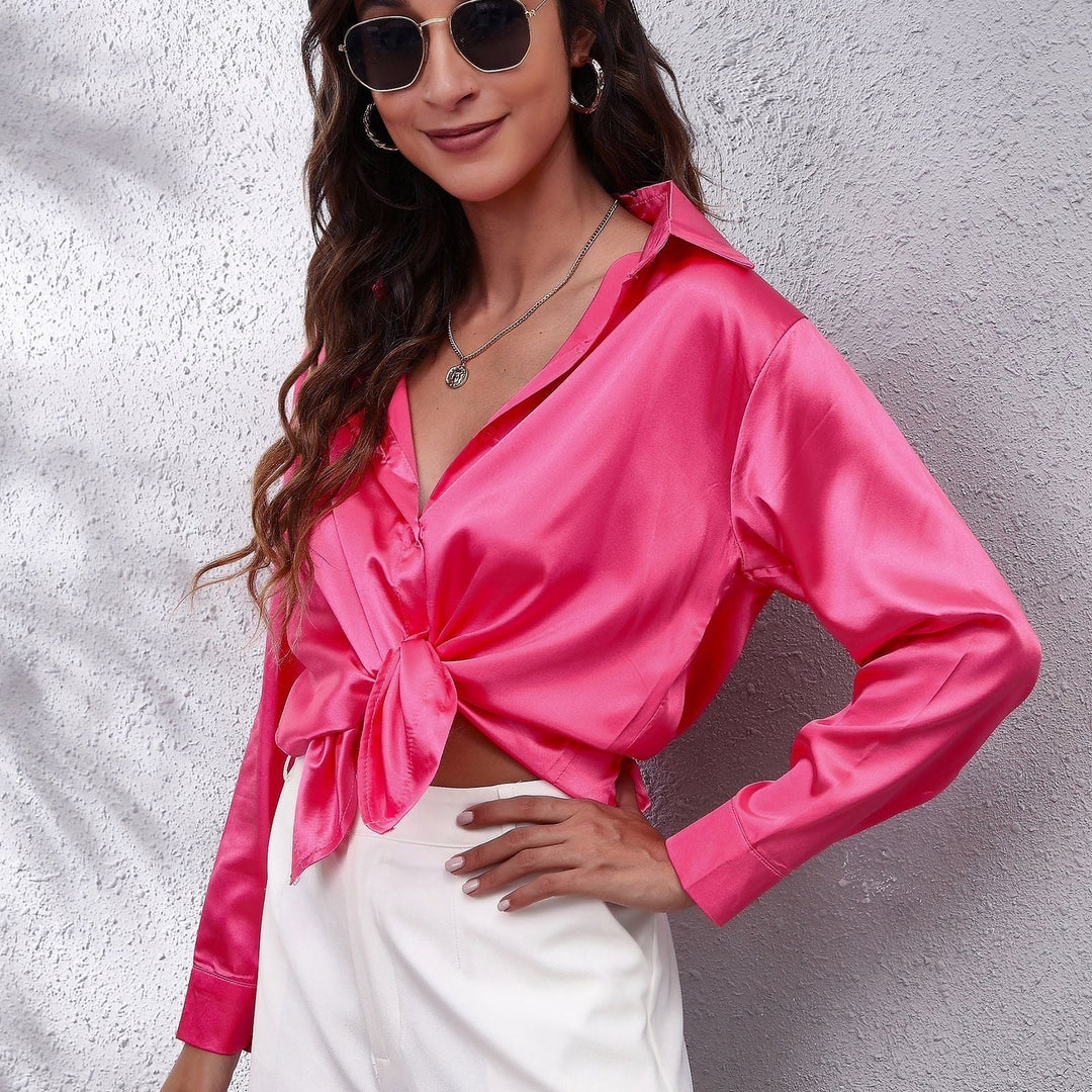 Soft peach satin casual blouse for women, featuring a comfortable loose fit and button-down front