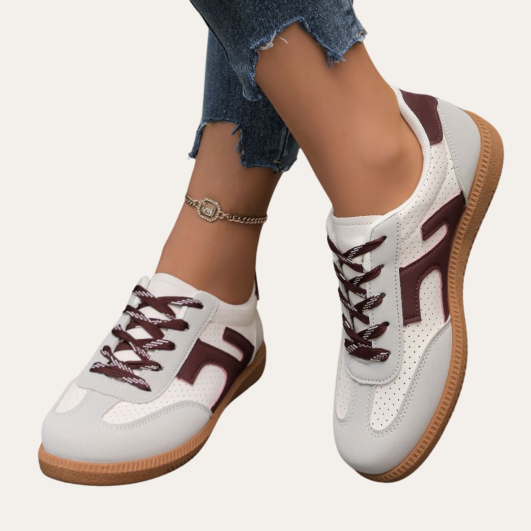 Lace-up canvas sneakers for women, offering comfortable and stylish everyday footwear for spring