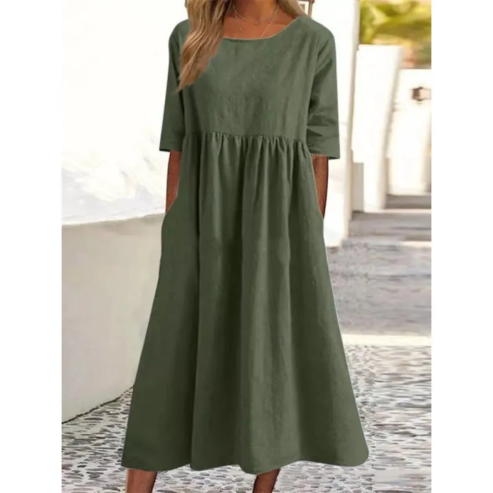 Women's casual maxi dress with practical pockets & elegant half-sleeves for effortless everyday style.