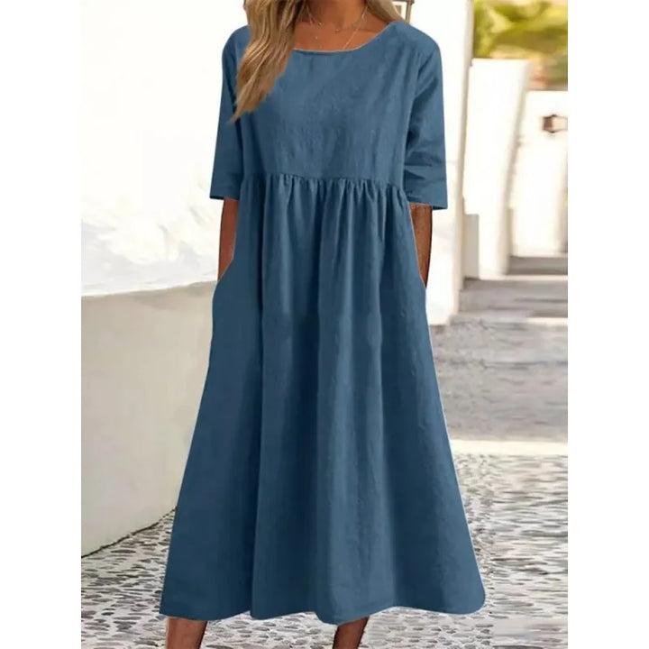 Modest ankle-length maxi dress for women, with comfortable half-sleeves & convenient side pockets.