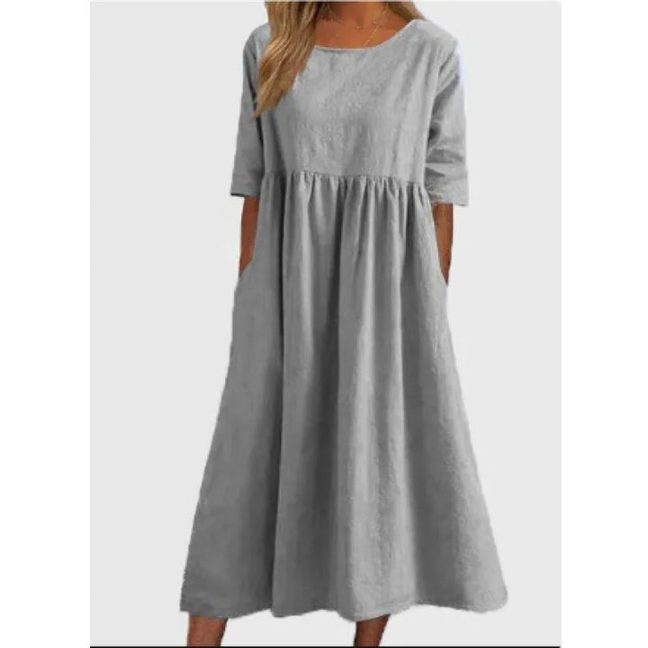 Chic women's maxi dress with half-sleeves and pockets, offering relaxed fit for everyday comfort.