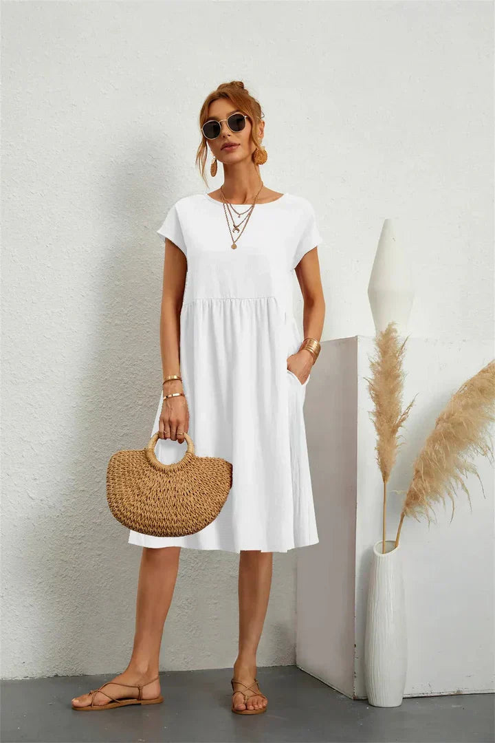 Effortless women's casual midi dress with pockets. Comfortable short sleeve, perfect for everyday style.
