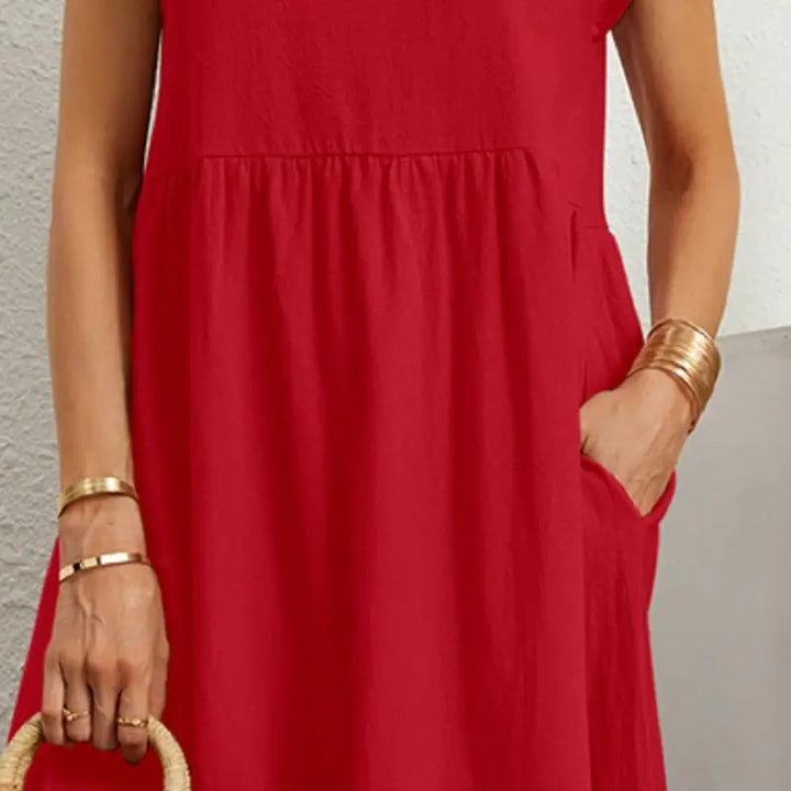 Woman wearing a comfortable casual midi dress with pockets, perfect for a relaxed spring day.
