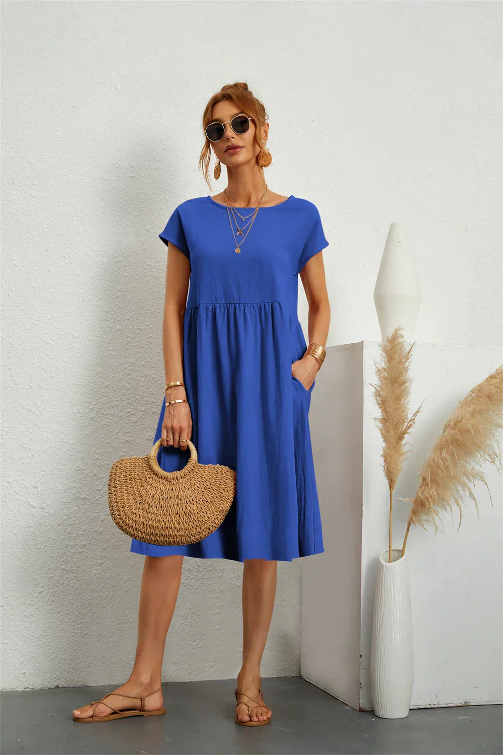 Everyday women's casual midi dress. Short sleeve, comfortable, loose fit, with handy pockets.