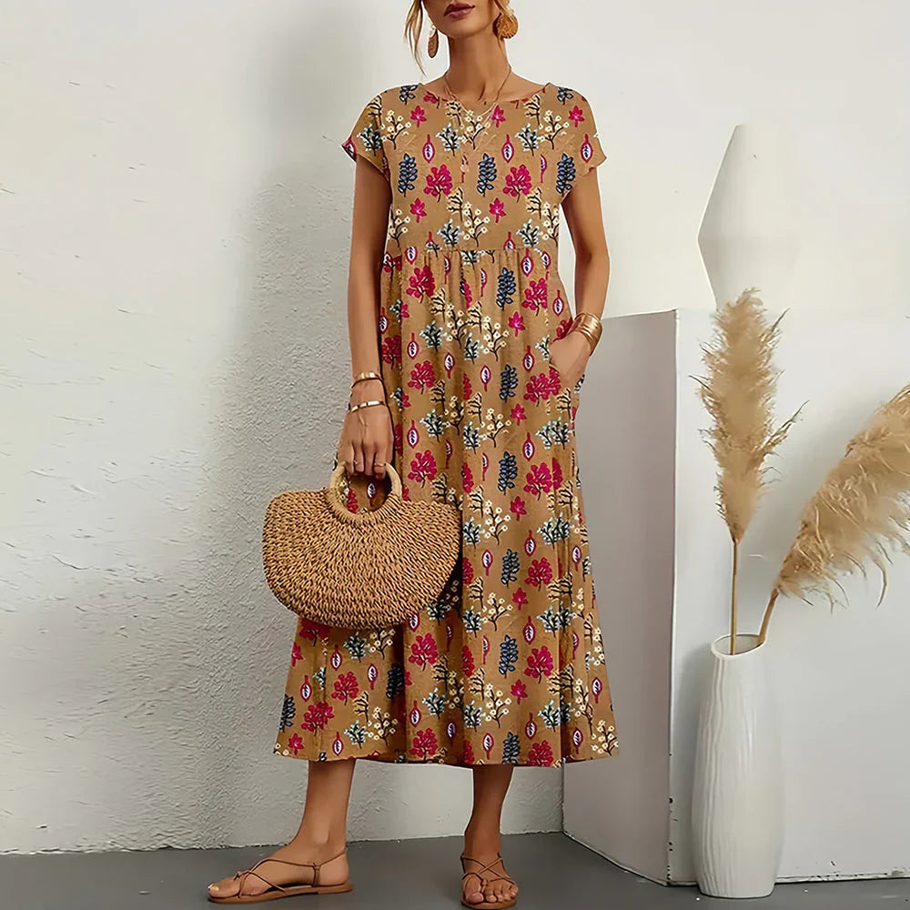 Women's casual midi dress with round neck, cap sleeves, relaxed fit. Effortless spring/summer style.